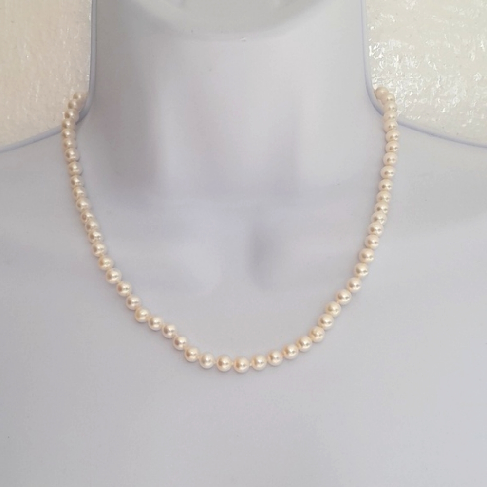 Genuine white pearls strand 18” long with sterling silver clasp